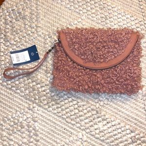 NWT fuzzy rosy pink clutch with handle